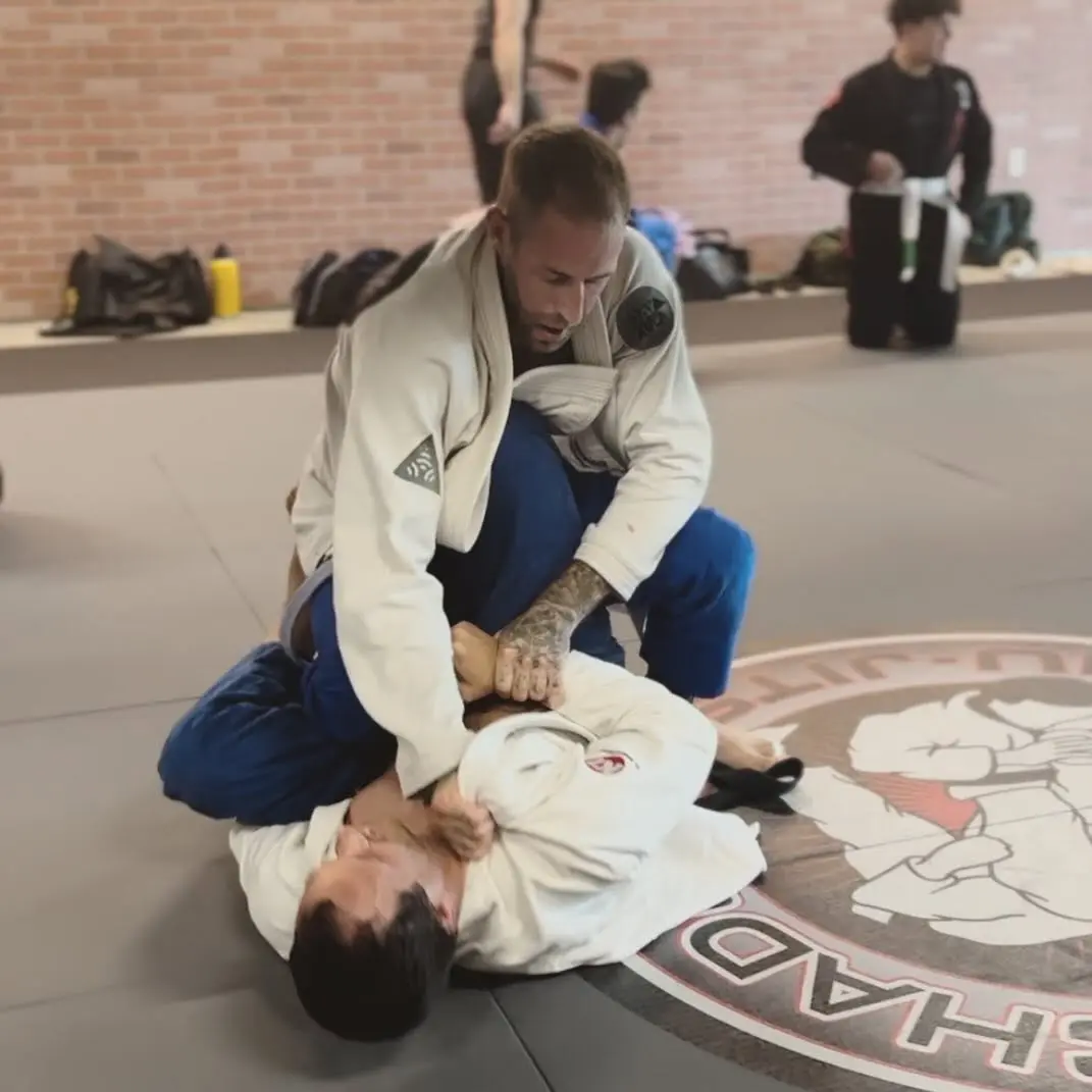 Two adults rolling in Brazilian Jiu-Jitsu gis at 805 Combat Sports in Simi Valley