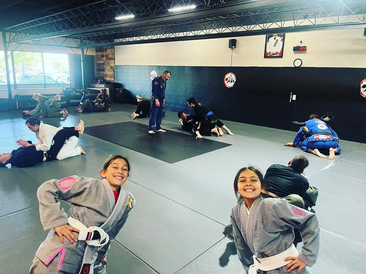 Two young students smiling during a kids class at 805 Combat Sports in Simi Valley