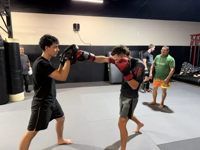 Two students drilling boxing combinations during a Muay Thai class at 805 Combat Sports in Simi Valley