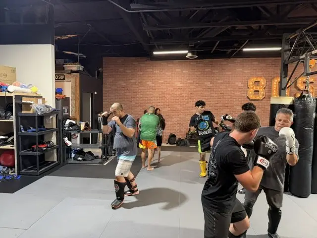 A Muay Thai kickboxing class training striking at 805 Combat Sports in Simi Valley