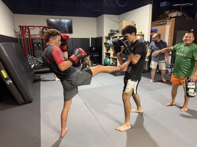 Two students sparring during a Muay Thai class at 805 Combat Sports in Simi Valley
