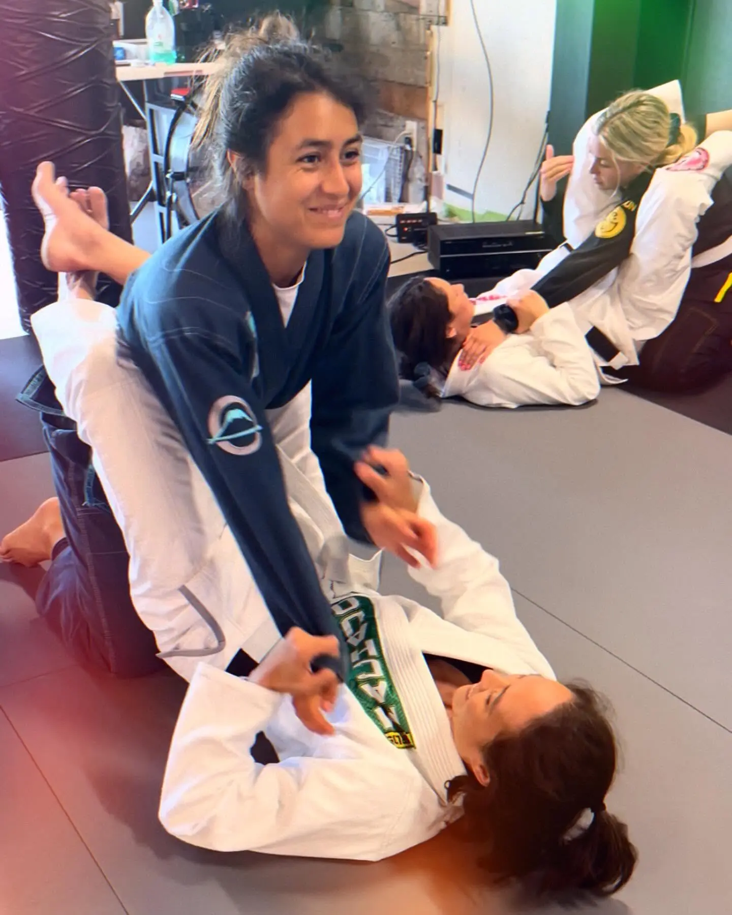 A woman working a Brazilian Jiu-Jitsu position during class at 805 Combat Sports in Simi Valley